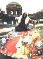 Janis on top of her Porsche